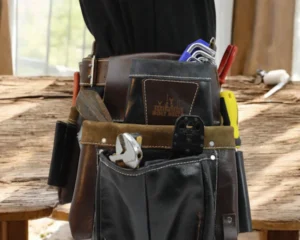 A handyman’s tool belt on a workbench